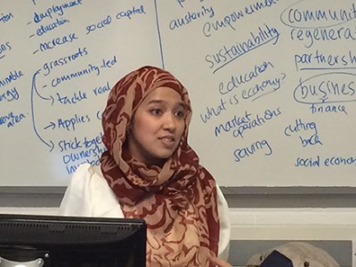 Image of Faaria Ahmad presenting the SUSY project to students